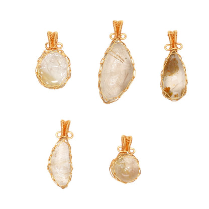Rutilated quartz pendant, irregular shape — Gold-plated brass wire setting