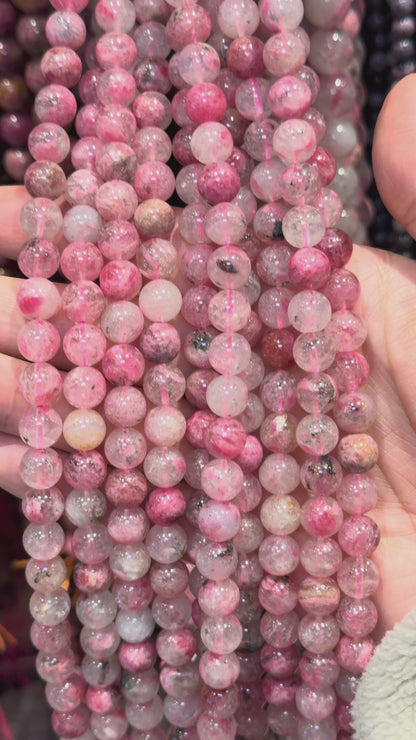 Fil de perle Rhodonite sur Quartz du Brésil AAA