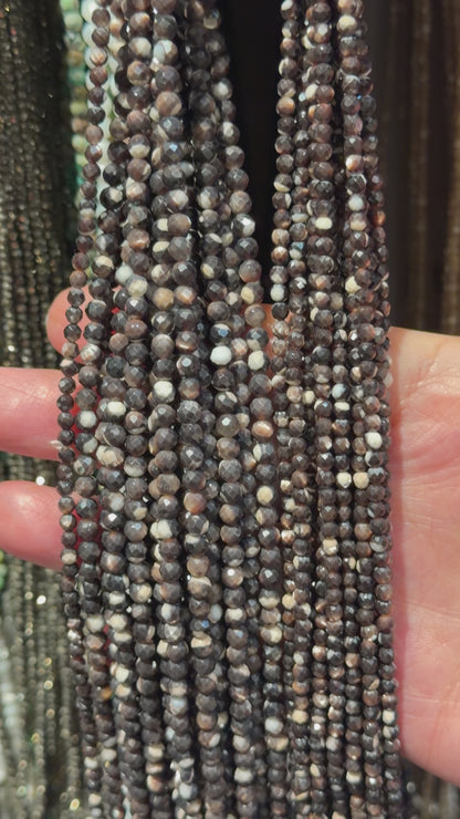 Black mother-of-pearl faceted bead strand
