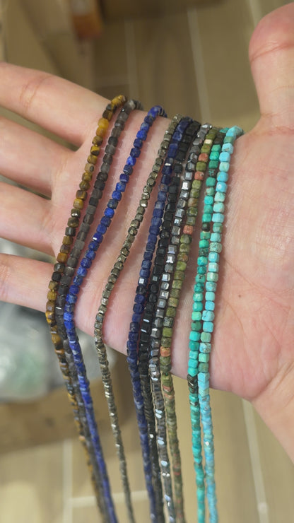 Strand of faceted square beads 2x2 mm (9 stones available)