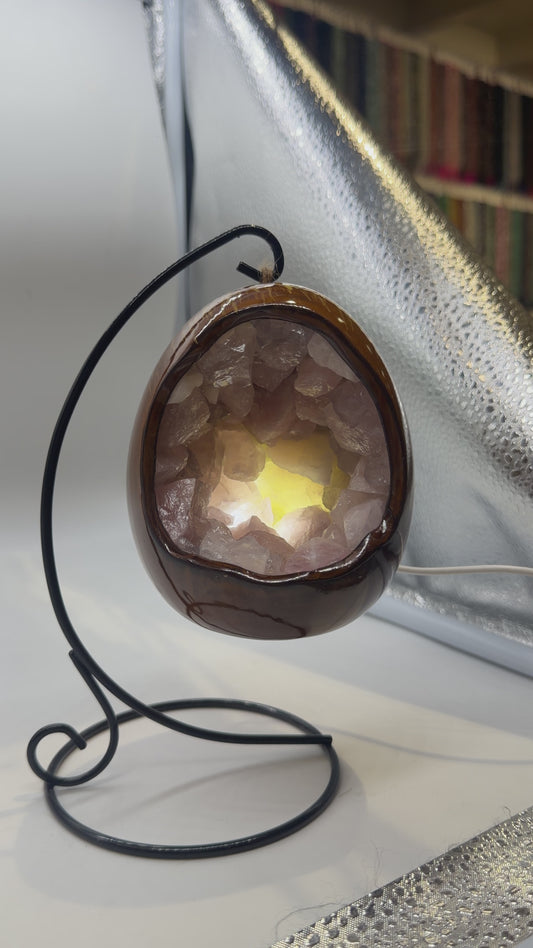 Rose quartz and ceramic egg lamp with black stand included.