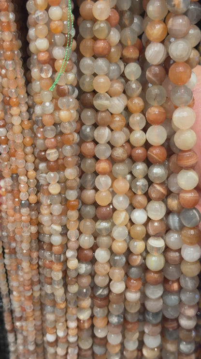 Strand of faceted multicoloured moonstone beads